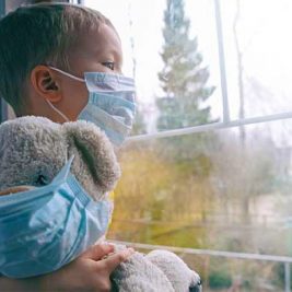Child with Masked Teddy Bear